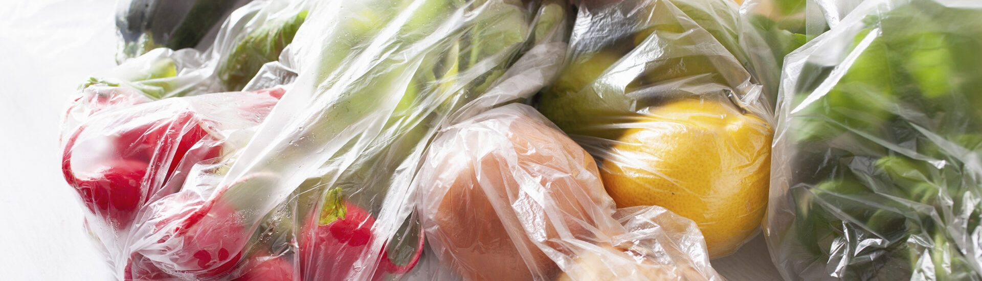 single use plastic waste issue. fruits and vegetables in plastic bags